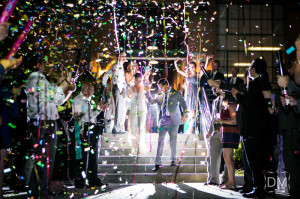 exploding streamers shooting over bride and groom during exit at Puritan Mill wedding
