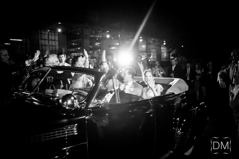 Vintage car for wedding exit with bride and groom puritan mill wedding.