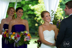 Bride smiling at groom during Cator Woolford Wedding Ceremony