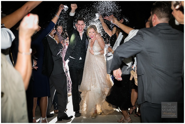 Bride and groom's grand exit at end of wedding reception at swan house atlanta history center