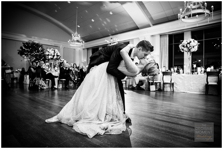 Groom dips bride during first dance at swan house atlanta history center