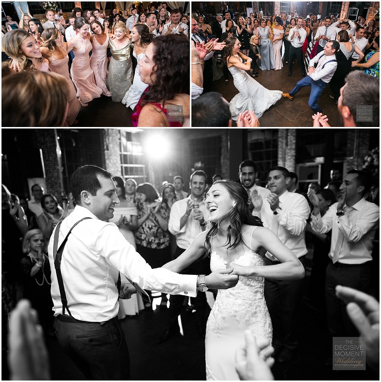 The bride and groom dance with all their reception guests at their Foundry at Puritan mill wedding