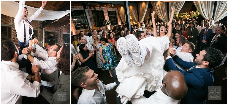 The bride crowd surfs at her Foundry at Puritan Mill Wedding reception