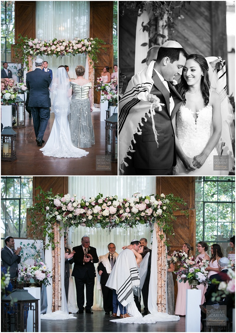 Bride is walked down the aisle by her parents and the bride and groom say I do and seal it with a kiss at their Foundry at Puritan Mill wedding
