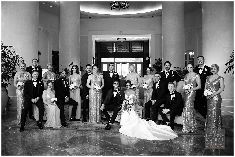 The wedding party take a group photo at the Intercontinental Buckhead Atlanta hotel