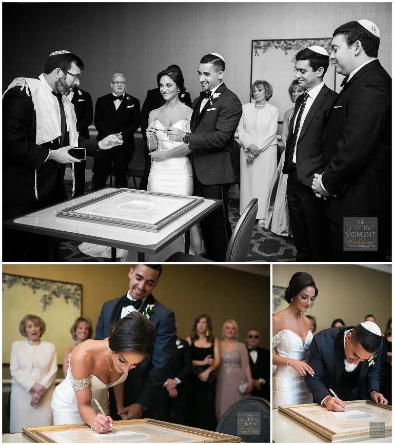 Bride and groom sign the Ketubah